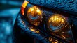 © Emma - Close up of rain-splattered headlights at dusk