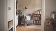 © LollaFlare - a cozy minimalist reading nook with a comfortable chair, a small bookshelf filled with books, and a floor lamp.