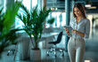 © Rapid Stock - Smiling and Beautiful IT Businesswoman working away from her office on a bright sunny day holding a tablet,  with copyspace