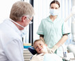 © peopleimages.com - Dentist, child and checkup with woman at clinic for appointment, teeth whitening and dental hygiene. Happy, people or patient for mouth cleaning, braces treatment and medical advice of oral wellness