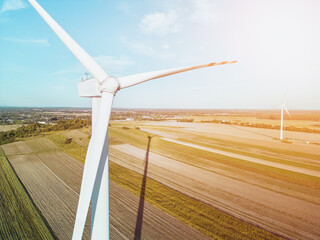 Wall Mural - Wind turbine in rural sunset landscape