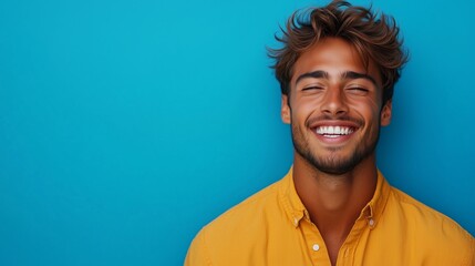 Wall Mural - Portrait of a happy handsome man in a shirt with laughing