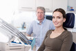 © peopleimages.com - Portrait, dentist and patient with checkup at clinic for cleaning treatment, bacteria assessment or teeth whitening. Man, woman and dental hygiene, root canal and tooth extraction for mouth wellness