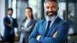 © Andrei - Confident Mature Businessman Smiling in Office, Leadership, Teamwork, Success Concept