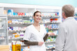© peopleimages.com - Pharmacist, customer and help for medicine, care or wellness in drugstore, chemist or pharmacy. Medical professional, female person and man for prescription or info in dispensary as advice or support