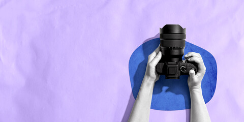 Poster - Person holding a SLR camera from above