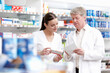 © peopleimages.com - Employees, pharmacists and reading prescription for medication, pills and information at drugstore box. People, pharmacy and serious with checklist for product, medicine and treatment for healthcare