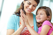 © GR/peopleimages.com - Hug, mom and care for child, affection and bonding with daughter, calm and comfort for girl and family. Embrace, mother and smile for kid, relax and motherhood for woman, adoption or together in home