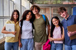 © Gigi Delgado - Cheerful portrait of a multiracial group of university students looking at camera smiling, gathered after class.