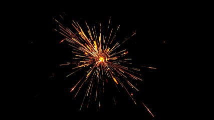 Wall Mural - A close-up of a burning sparkler against a dark background.