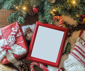 Wall Mural - Blank template of white paper sheet, red wooden border, holiday decorations background. Square frame mock up. Empty poster template for Christmas, New Year party invitation, greeting card, poster