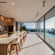 © Violetta - Modern kitchen with open layout and ocean view through large windows during daylight