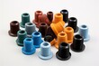 © Maksym - Colorful assortment of plastic threaded inserts arranged on a white background for product display