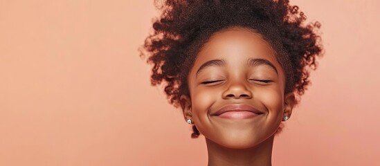 Poster - Joyful charming African American girl isolated against a pastel background Smiling face Genuine emotions. with copy space image. Place for adding text or design