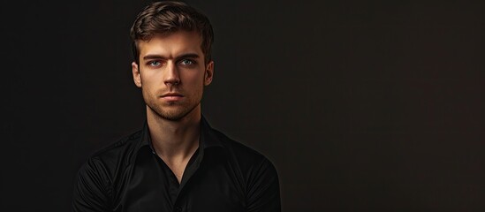 Poster - Unedited male portrait in a black shirt. with copy space image. Place for adding text or design