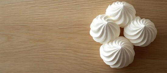 Poster - Meringue Tasty homemade meringues on a wooden surface. with copy space image. Place for adding text or design