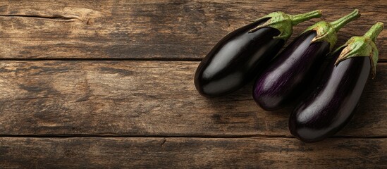 Poster - Vegetarian menu template small fresh eggplants on a wooden table with copyspace healthy food