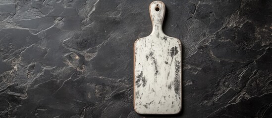 Poster - White vintage cutting board on a black background. with copy space image. Place for adding text or design