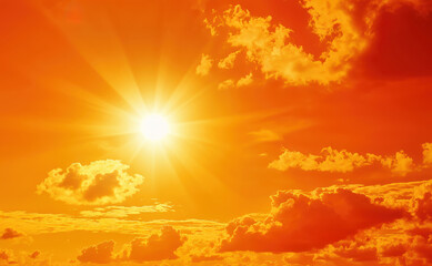 Poster - Bright sun shining through the clouds in orange sky with white and gray clouds
