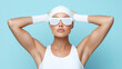 © ChaoticDesignStudio - Fashionable model in white athletic wear poses confidently against a light blue backdrop