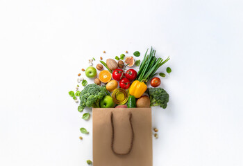 Poster - A brown paper bag spills over with fresh produce, including green onions, broccoli, apples, peppers, and tomatoes.