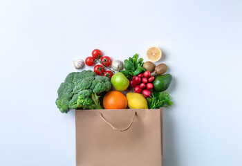 Poster - A paper bag overflowing with fresh produce, including broccoli, citrus fruits, tomatoes, and leafy greens.