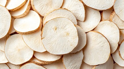 Poster - Closeup Macro Shot of Sliced Cassava Revealing Its Starchy and Nutritious Interior  Cassava is a Tropical Root Vegetable Commonly Used in South American Cuisine and as a Dietary Staple