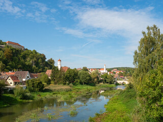 Harburg, Germany - September 29th 2023: View over the Woernitz river towards the town with the famous castle