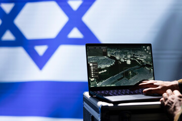 Poster - Military operative engaged in surveillance mission using laptop, looking at aerial map of conflict zone. Intelligence corps officer working on notebook, monitoring zone of interest