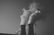 © AssanAI.Studio - Cooling Towers Emitting Steam at Power Plant