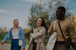 © qunica.com - A joyful group of friends spending a carefree day outdoors, walking and laughing while enjoying each other's company. The setting is peaceful and full of natural beauty.