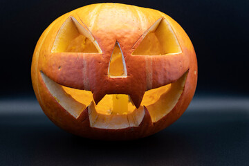 Pumpkin (Jack-o-lantern) close-up on a black background