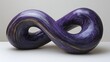 © Budi - A sculptural representation of infinity, featuring a smooth, purple design with gold accents.