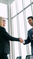 Poster - business people handshake with friend at office showing trust , friendship and success celebration .