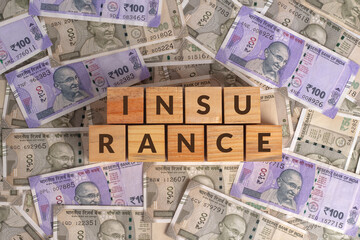 Insurance Word on Wooden Cubes with Indian Currency Background | Financial Growth Concept