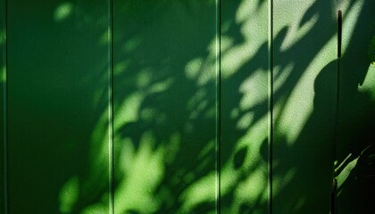 Poster - Sunlit Leaf Shadows on Textured Green Surface. Minimalistic Nature Inspired Background with Natural Light Play, Perfect for Eco Themed Designs, Wellness Concepts, and Organic Product Promotion