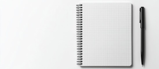 Poster - Vertical checkered spiral bound notepad or notebook alongside a pen isolated on a white background top view. with copy space image. Place for adding text or design