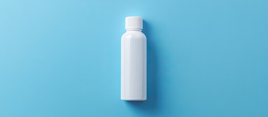 Poster - White plastic bottle that contained glue set against a blue background Flat lay top view. with copy space image. Place for adding text or design