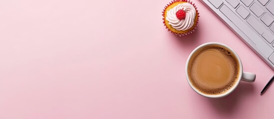 Poster - Home office desk Workspace featuring coffee and a cupcake Flat lay top view on a pink background Coffee break. with copy space image. Place for adding text or design