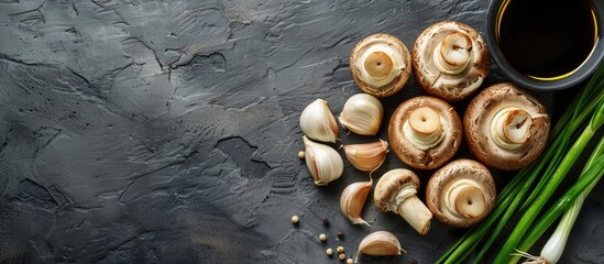 Fototapete - Overhead view of organic mushrooms scallions spring onions and garlic butter with extra virgin olive oil. with copy space image. Place for adding text or design
