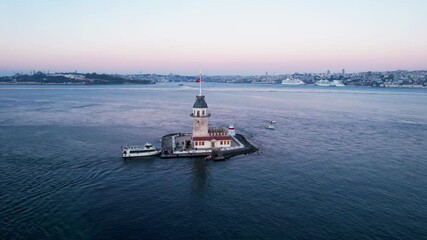 Wall Mural - Maiden's Tower with beautiful sunrise sky in Istanbul, Turkey. (Turkish Name: Kiz Kulesi). Colorful sunrise sky in Istanbul. Drone shot.