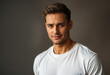 © Aillusionist - Young man, brown hair, white tshirt, grey background, smiling. Young man with brown hair, in white tshirt, smiling on grey background. Ideal for lifestyle blogs, social media posts, website banners.
