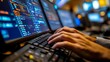 © weerayut - Close-up of hands typing on a keyboard surrounded by multiple computer screens displaying code and data analytics.