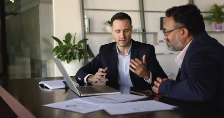 client and manager presents detailed proposal to client during negotiation process in company office