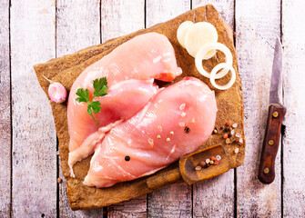 Wall Mural - Raw chicken breast or fillet with salt, pepper and fresh herbs