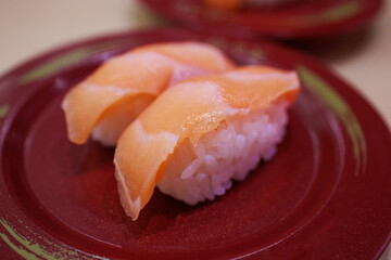 Wall Mural - Japanese fresh salmon sushi with Japanese rice in red plate