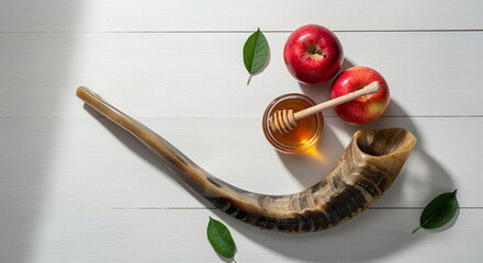 Apples with honey and shofar on a wooden table for Rosh Hashanah celebration