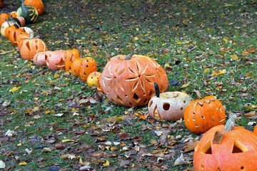 Carved pumpkins  omposition for Halloween.  Autumn outdoor decoration