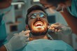 © Alina - Photo of young man sitting in a dental chair and male dentist treating his teeth