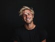© Tuyres - Smiling Blonde Man with Tousled Hair, Black Background. Generative AI.
